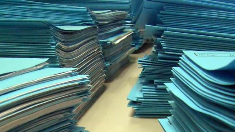Stacks of blue file folders in an office